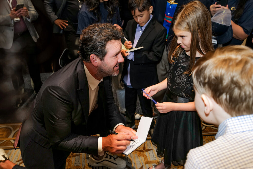 Tony Romo signing autograph (Photo by BFA and Tamytha Cameron)