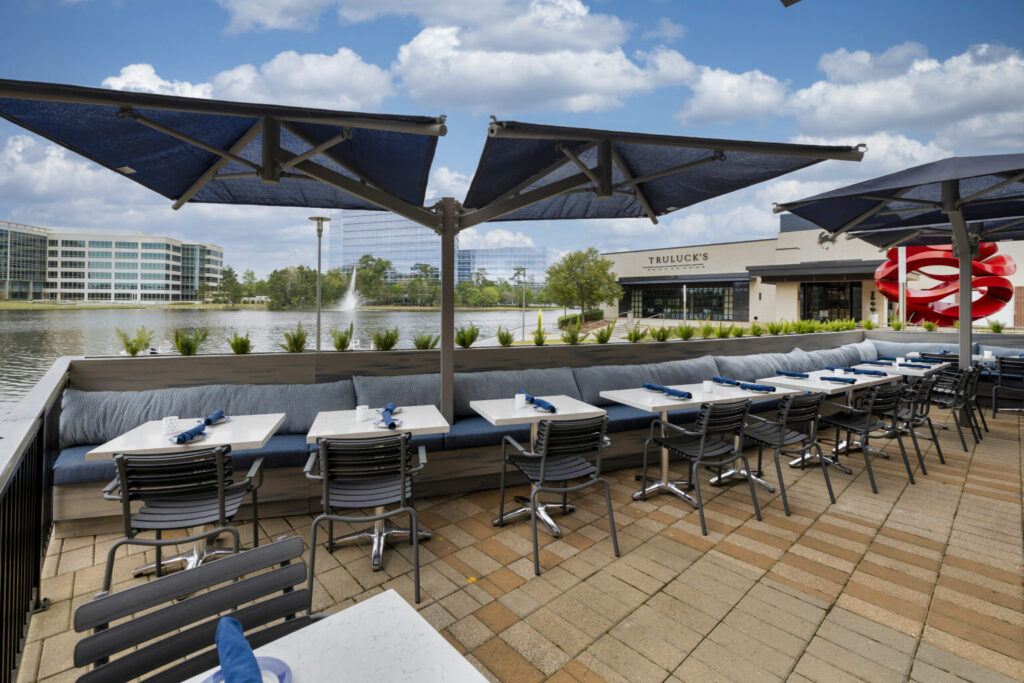 The view of Lake Woodlands from the patio at Azzurro Italian Coastal Cuisine is perfect for an outdoor meal.