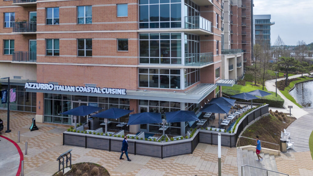 At the tip of Hughes Landing, Azzurro Italian Coastal Cuisine, has valet parking available in addition to nearby parking garages.