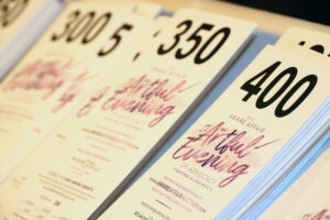 Bidder cards with logo (Photo by Lisa Stewart and Rob Wythe/Wythe Portrait Studio)