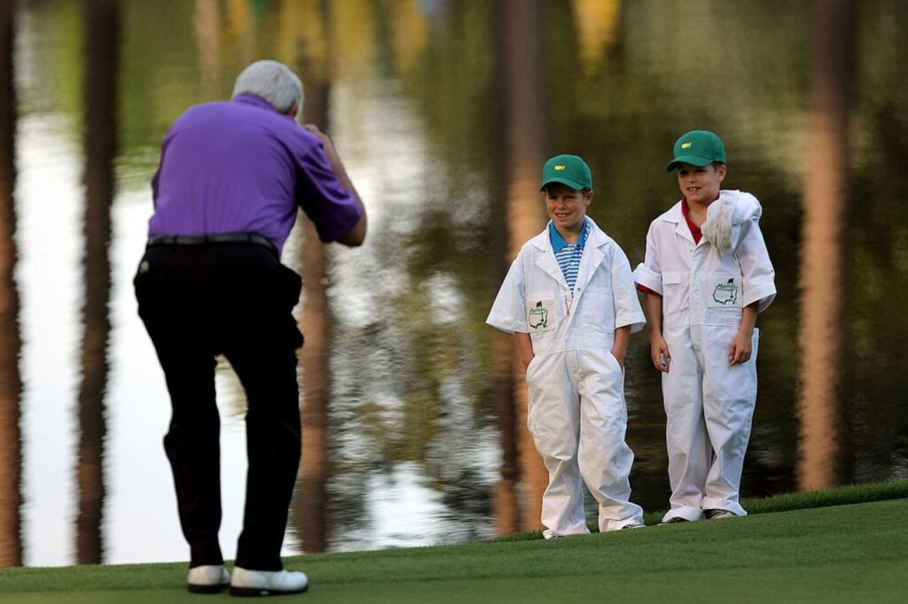 Charles Coody takes a picture of his grandsons during The Masters Par 3 Contest at the start of the 2008 tournament.