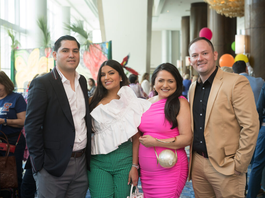 Eddie Mendoza, Adriana Trujillo, Daisy Mendoza, Manny Trillo at the Latin Women's Initiative fashion show and luncheon. (Photo by Daniel Ortiz)