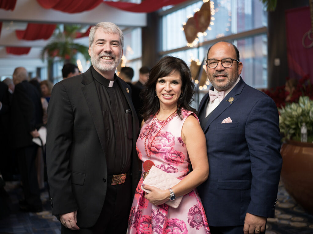 Father Jim Murphy, Christy & Dom Villarreal at the University of St. Thomas annual gala (Photo by Daniel Ortiz)