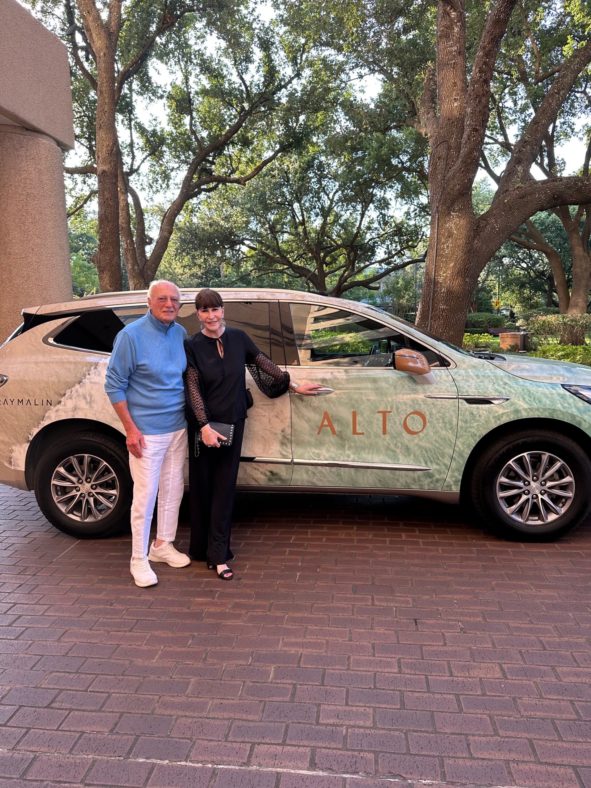 Shafik Rifaat & Shelby Hodge catch a lift to a weeknight party in Alto's Gray Malin art car.