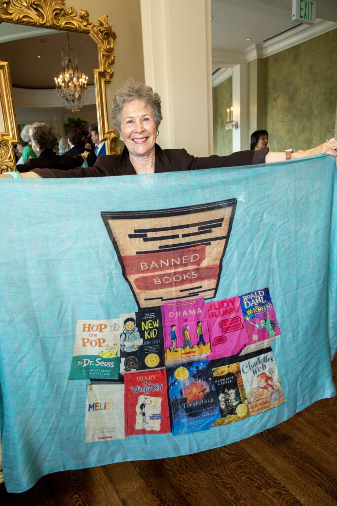 Kathryn Rabinow shows off her “Banned Books” scarf at Houston Center for Contemporary Craft Spring Luncheon.  (Photo by Jenny Antill Clifton)