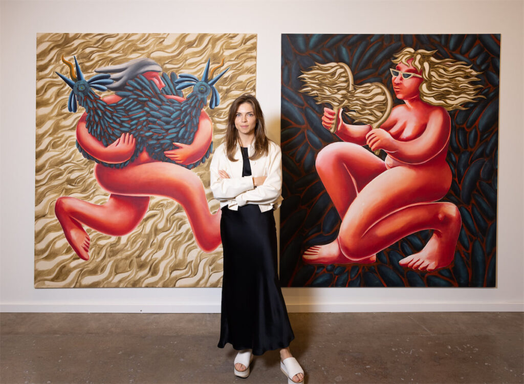 Katie Eva Gaj with Tamara Malcher's Amazone II, 2023 and Amazone I, 2023 at Dallas Art Fair (Photo by Exploredinary)