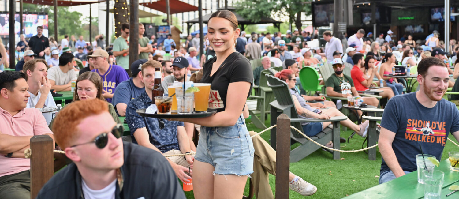 Outside, Kirby Ice House's big screen is great for groups to gather and watch the the Paris Olympics. This is one Woodlands ice house that keeps it cool. best sports bar The Woodlands