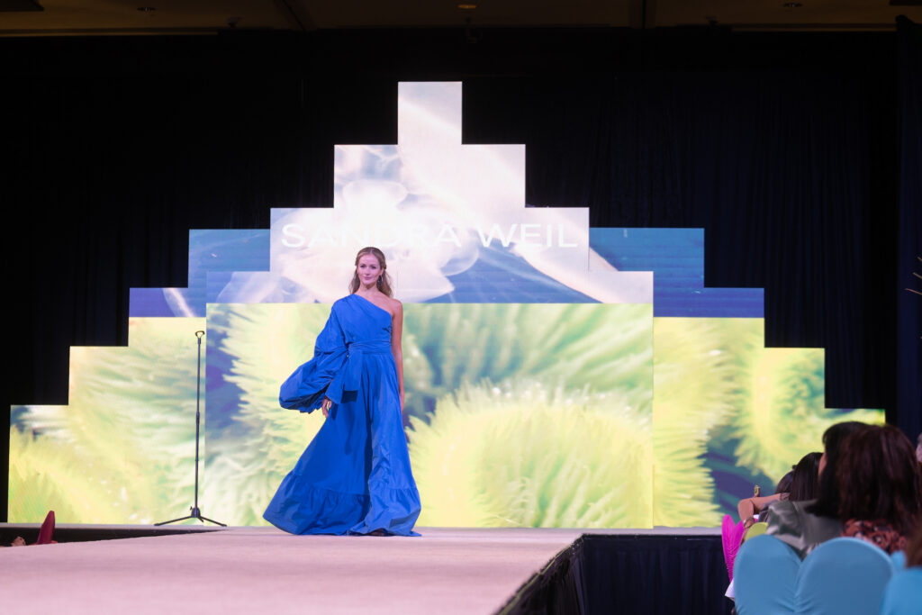 Sandra Weil fashions on the catwalk at the Latin Women's Initiative fashion show and luncheon.  (Photo by Daniel Ortiz)