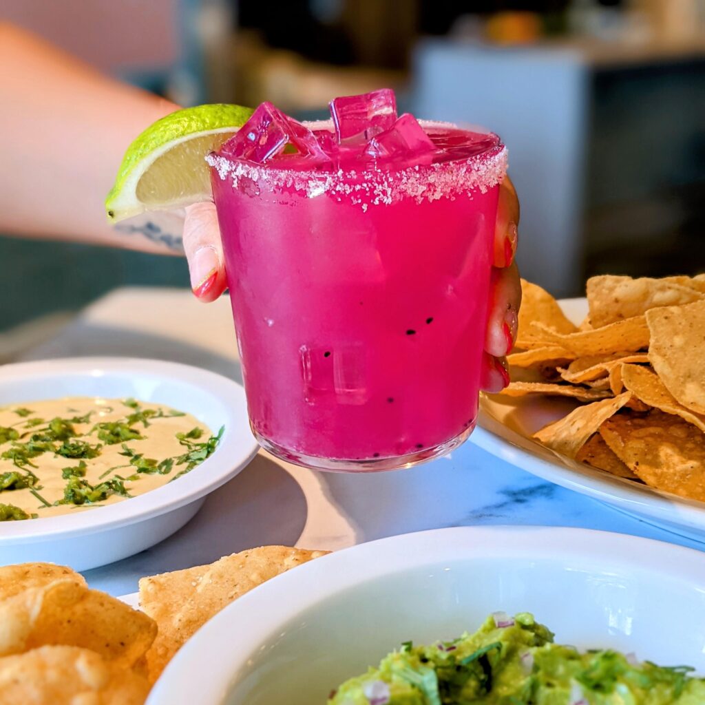 The pitaya margarita ($15) at Picnik is a bright magenta-colored concoction made with dragonfruit, raw honey, and lime juice. (Photo by Kimberly Davis Photography)