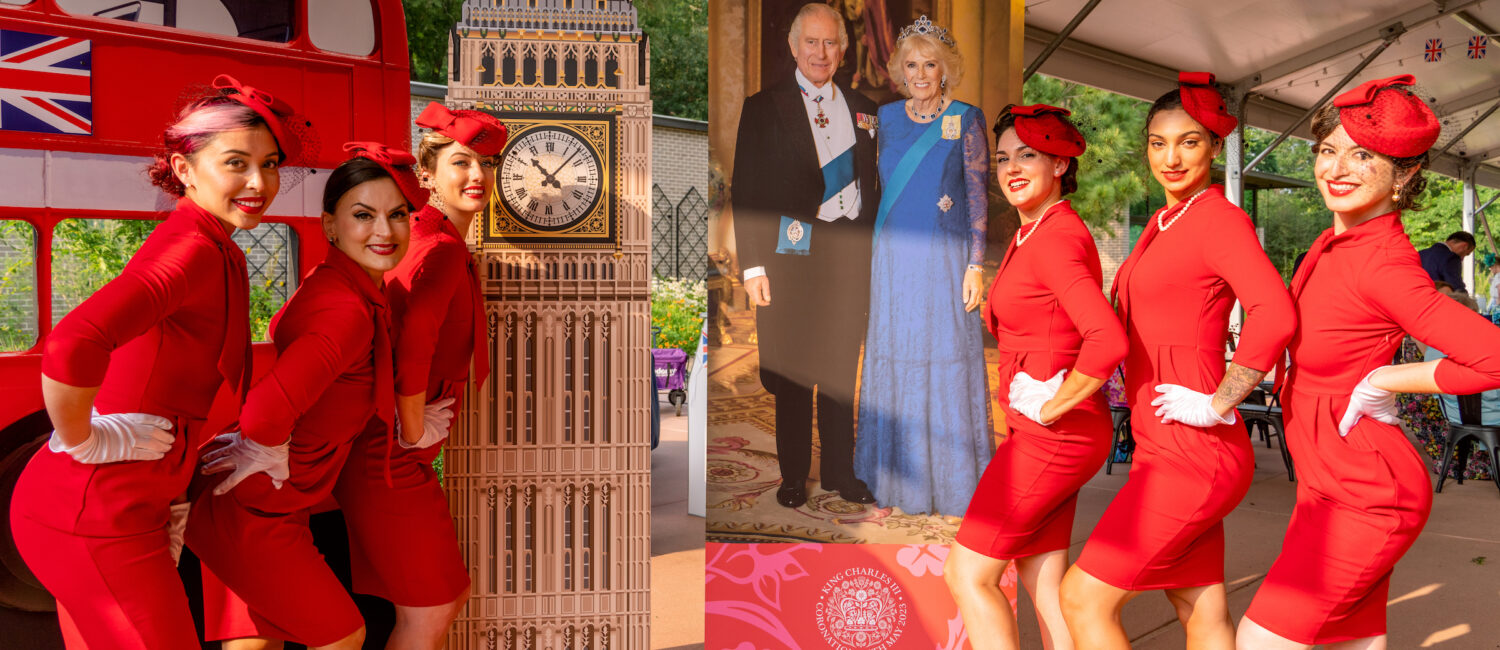 Costumed models flank colorful cutouts at the Houston Arboretum where invitation-only guests joined the celebration of the coronation of Britain's King Charles. (Photo by Joffre Camacho, Square Foot Photography)