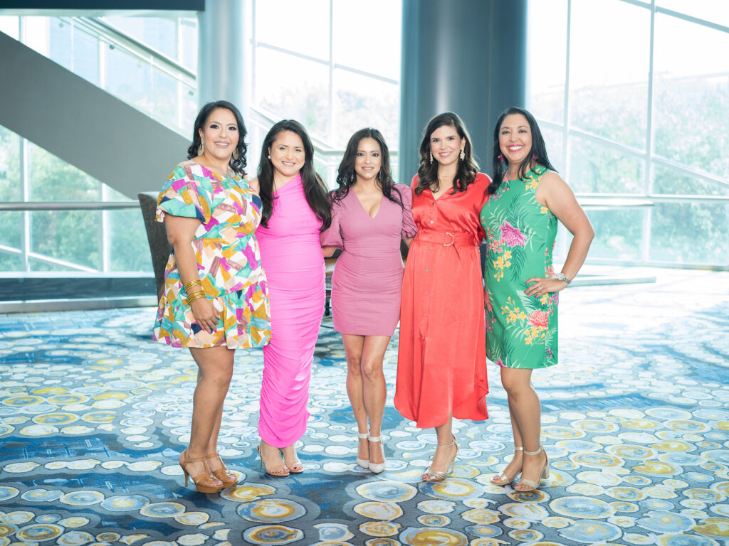 Susie Molina, Daisy Mendoza, Conchita Reyes, Gloria Bounds, Monica Casiano at the Latin Women's Initiative fashion show and luncheon. (Photo by Daniel Ortiz)