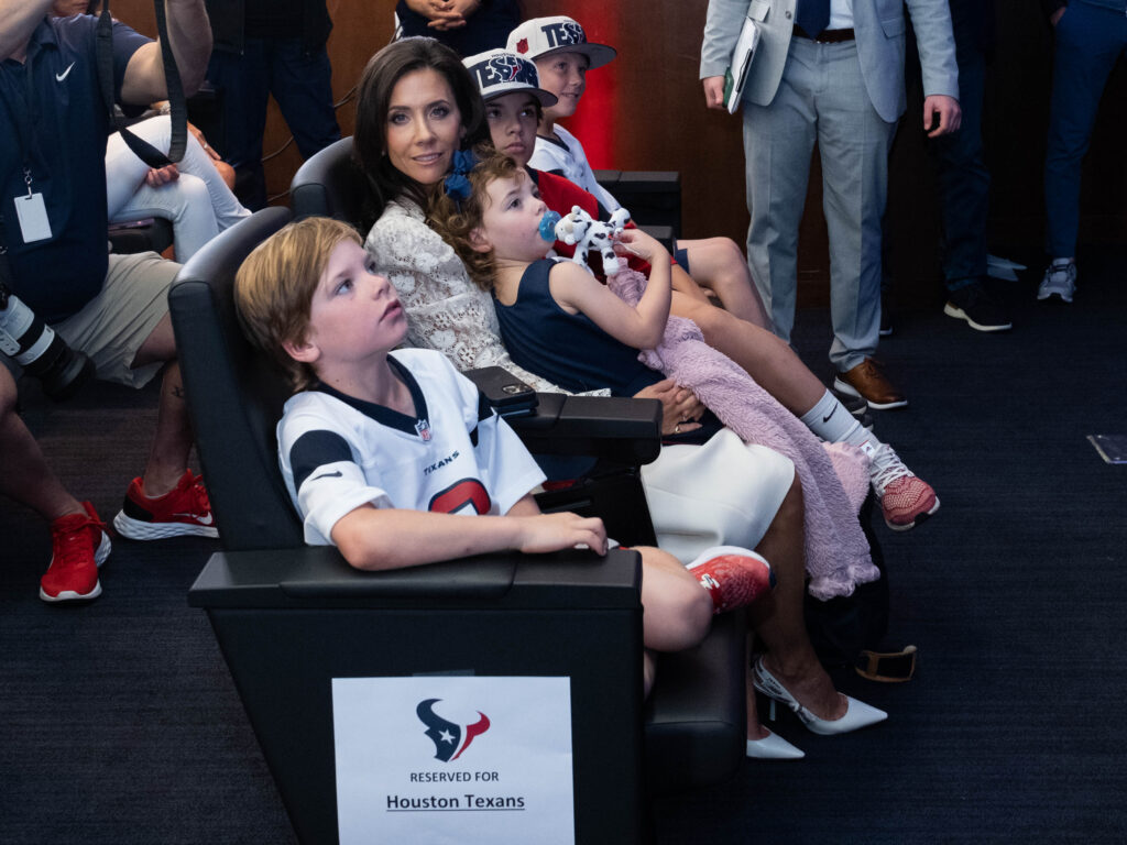 Hannah McNair and her kids watched the new Texans take the stage. (Photo by F. Carter Smith)