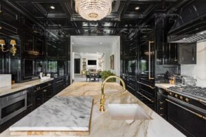 Westover – A moody black lacquer pops in the kitchen at 5700 Westover Court.