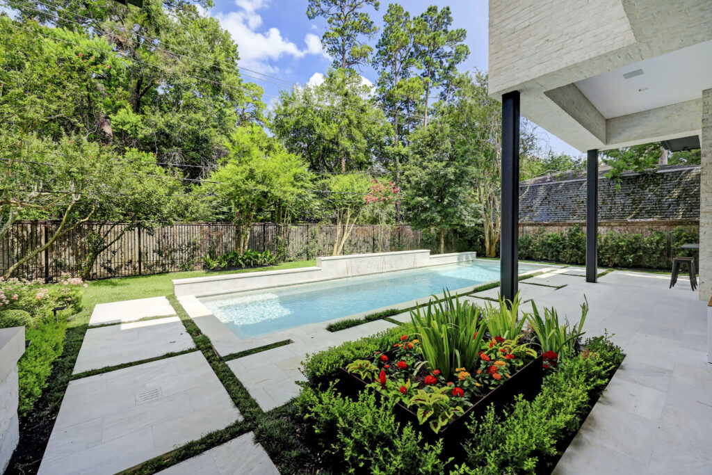 The lap pool at 410 Coachman in Bunker Hill, no ordinary Houston mansion. (Photo by TK Images)