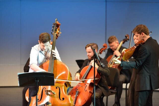 Soloist and Cleveland Symphony first assistant double bassist Charles Paul, is the composer's musical voice in Theo Chandler's love story for soprano, double bass and string orchestra, with text by the composer.
(Photo by Jeff Grass. Courtesy Kinetic Ensemble)