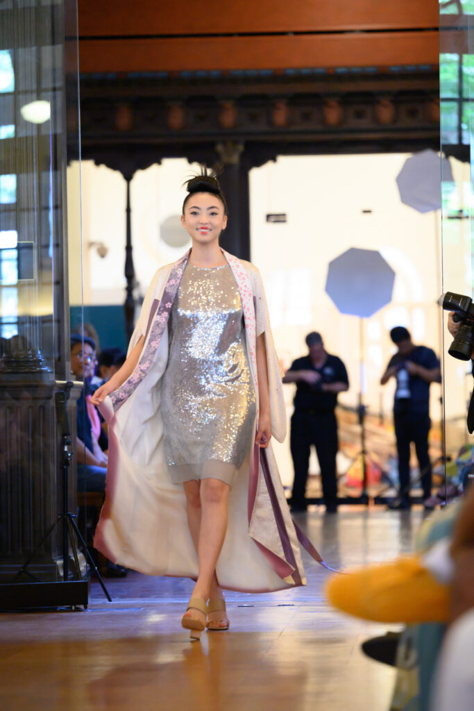 Kimono Zulu 's pink kimono modeled by Gina Nguyen at the Ascend AAPI Spring Fashion Show (Photo by Ken Jones)