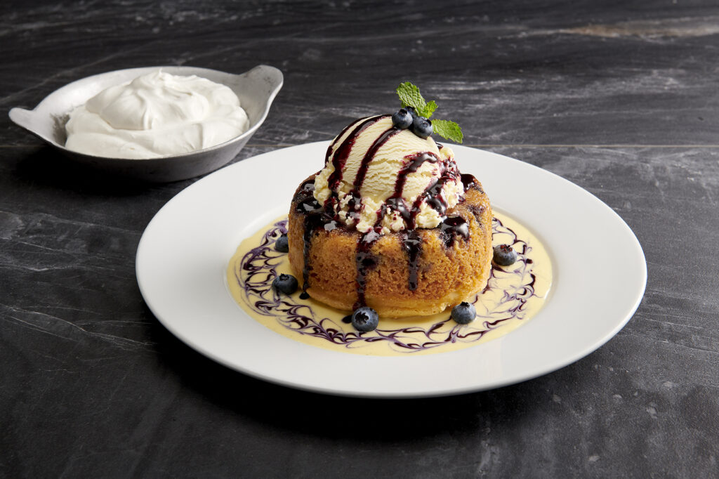 A seasonal twist on the ever-popular warm butter cake adds blueberries and lemon at Mastro's Ocean Club in The Woodlands.