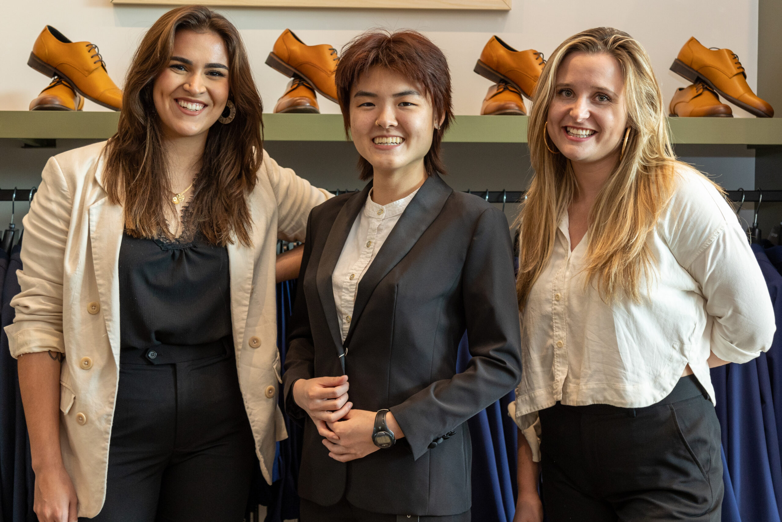 SuitShop stylist Alex Martinez, Caitlin Hsu and SuitShop Houston showroom manager Lyndsay Levitt pose at the fitting. (Photo by Adam Hart)