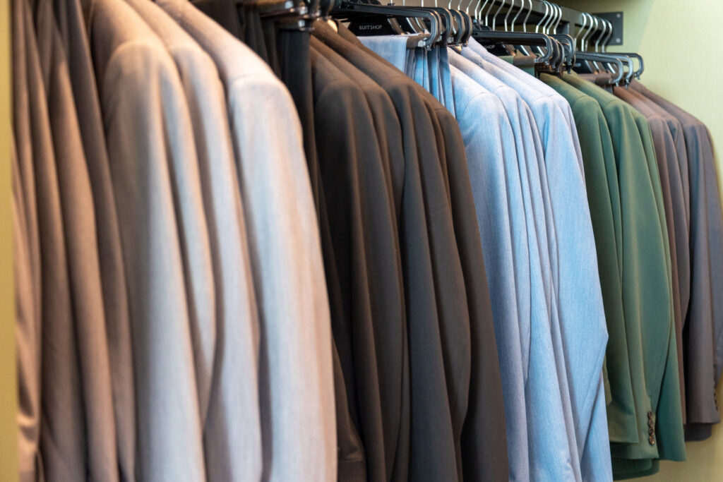 A neat rack of suit jackets on display. (Photo by Adam Hart)