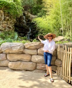 Zoo – Ramona Bass points to a waterfall, she calls one of the zoo’s follies. (Photo by Courtney Dabney)
