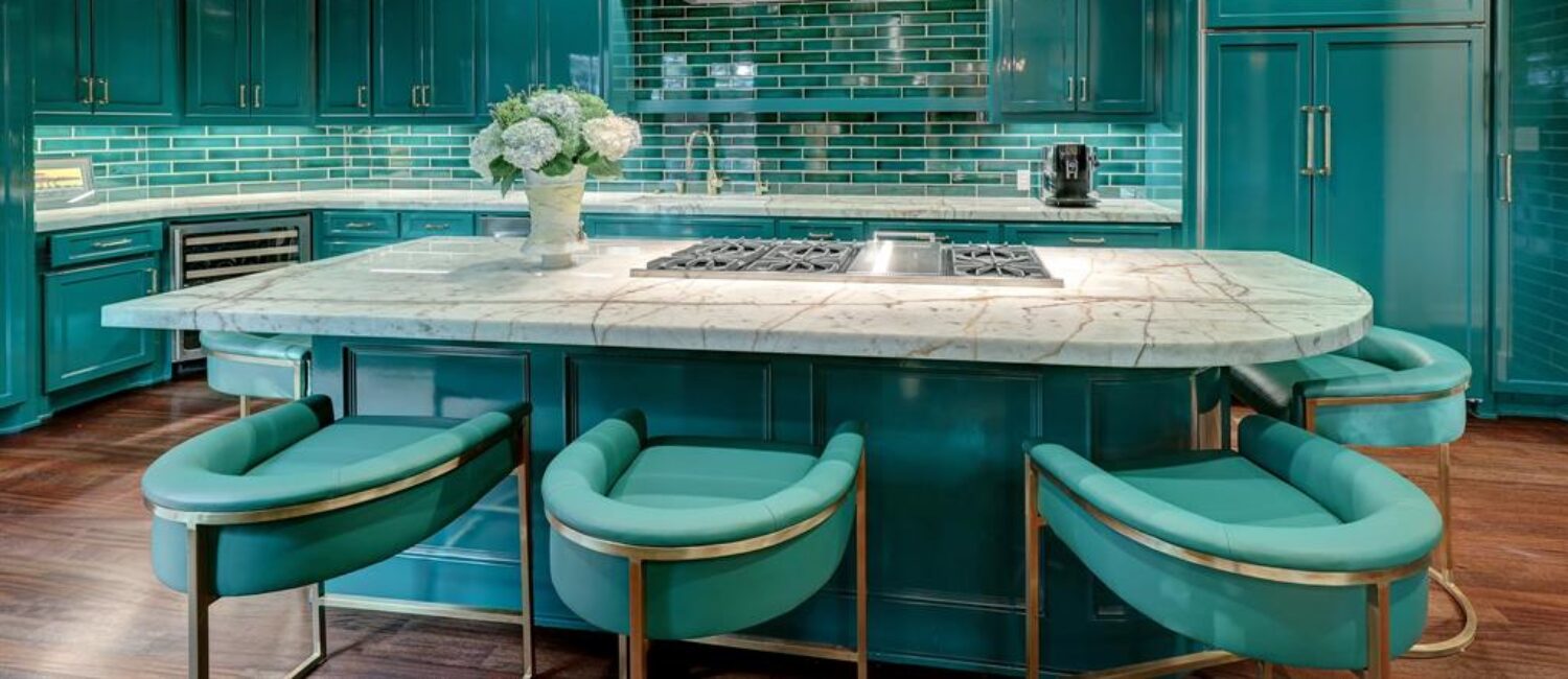 The turquoise kitchen in the luxurious 'Tuscan Villa' townhome at 5722 Logan Lane makes an impression, (Photo by TK Images/Compass)