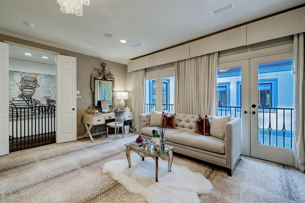 The primary bedroom in the luxurious 'Tuscan Villa' townhome at 5722 Logan Lane (Photo by TK Images/Compass)