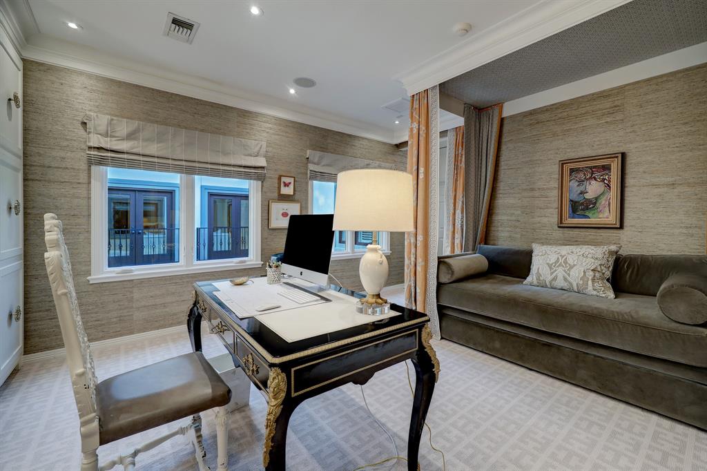 One of three bedrooms in the luxurious 'Tuscan Villa' townhome at 5722 Logan Lane (Photo by TK Images/Compass)