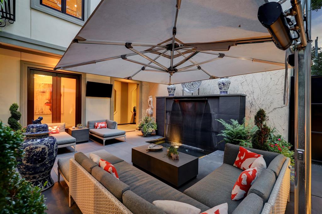 Outdoor entertaining is at its best in the luxurious 'Tuscan Villa' townhome at 5722 Logan Lane (Photo by TK Images/Compass)