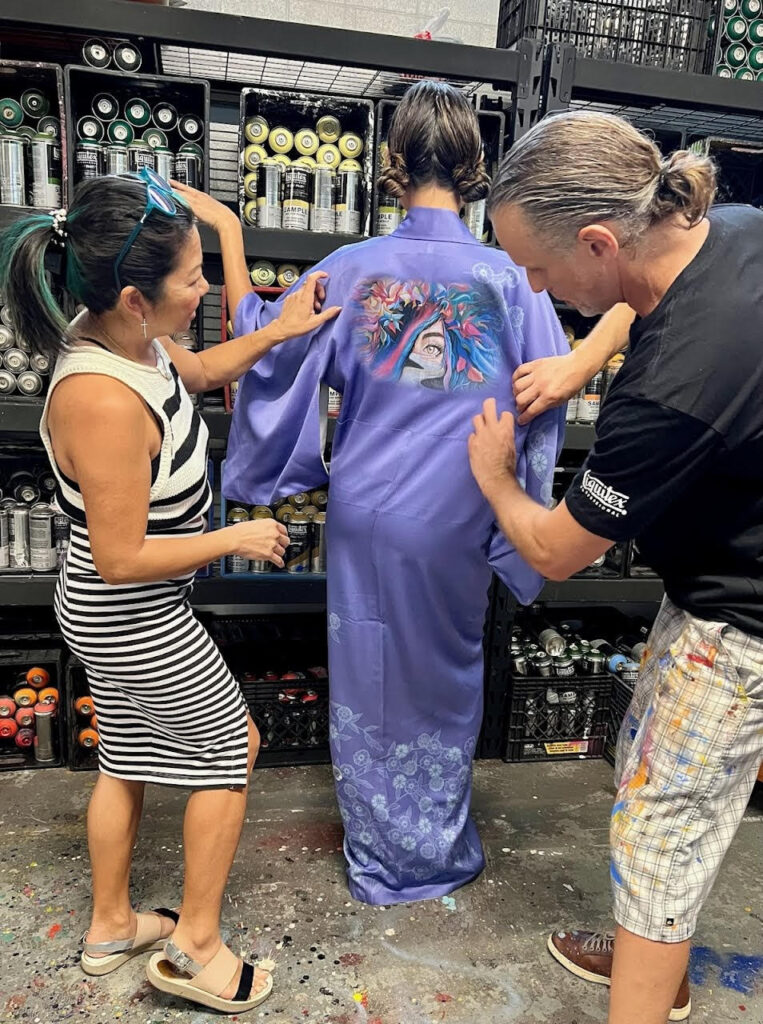 Mr. D 1987 and Tina Zulu discuss art direction for the "Keep Your Eyes on the Road" kimono to be featured at the MFAH Trunk Show courtesy of Kimono Zulu