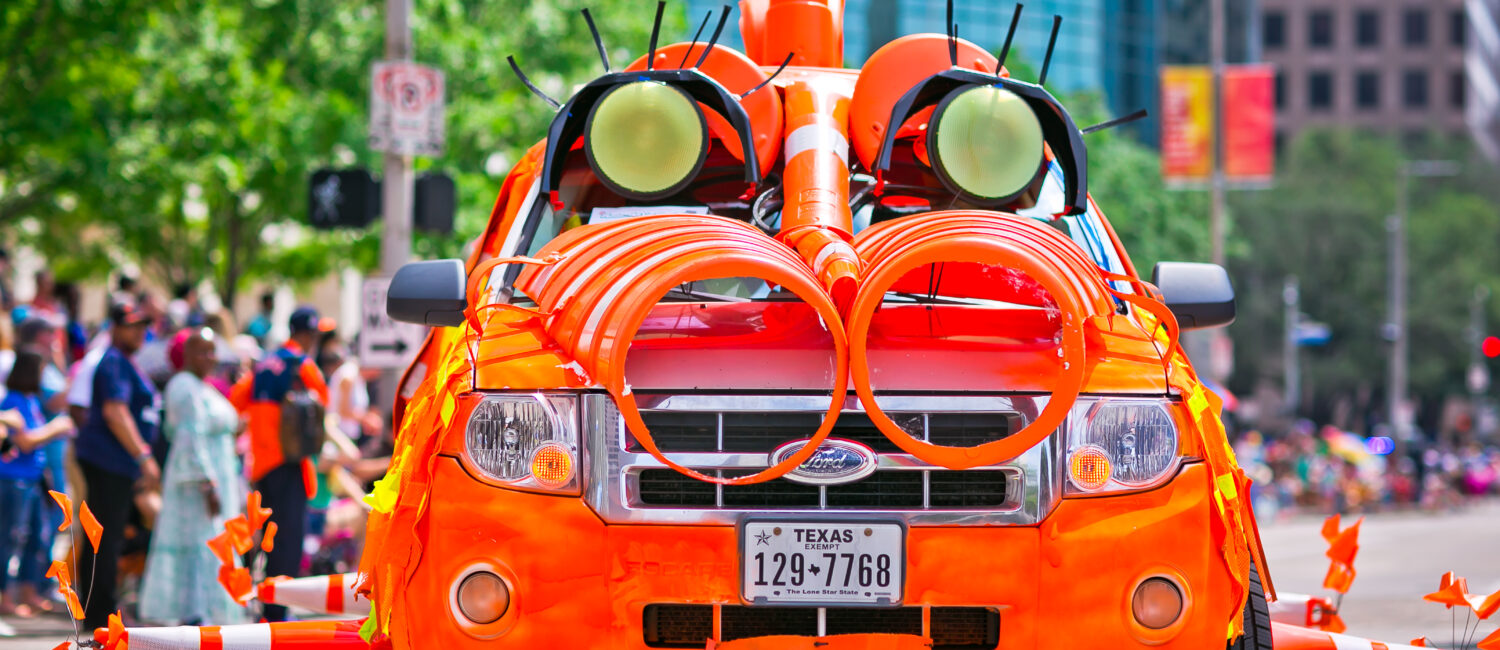 The 2023 Orange Show Art Car Parade, featuring cars like "Traffic Cone Safety Monster." (Photo by Morris Malakoff and Danitza Ladwig)