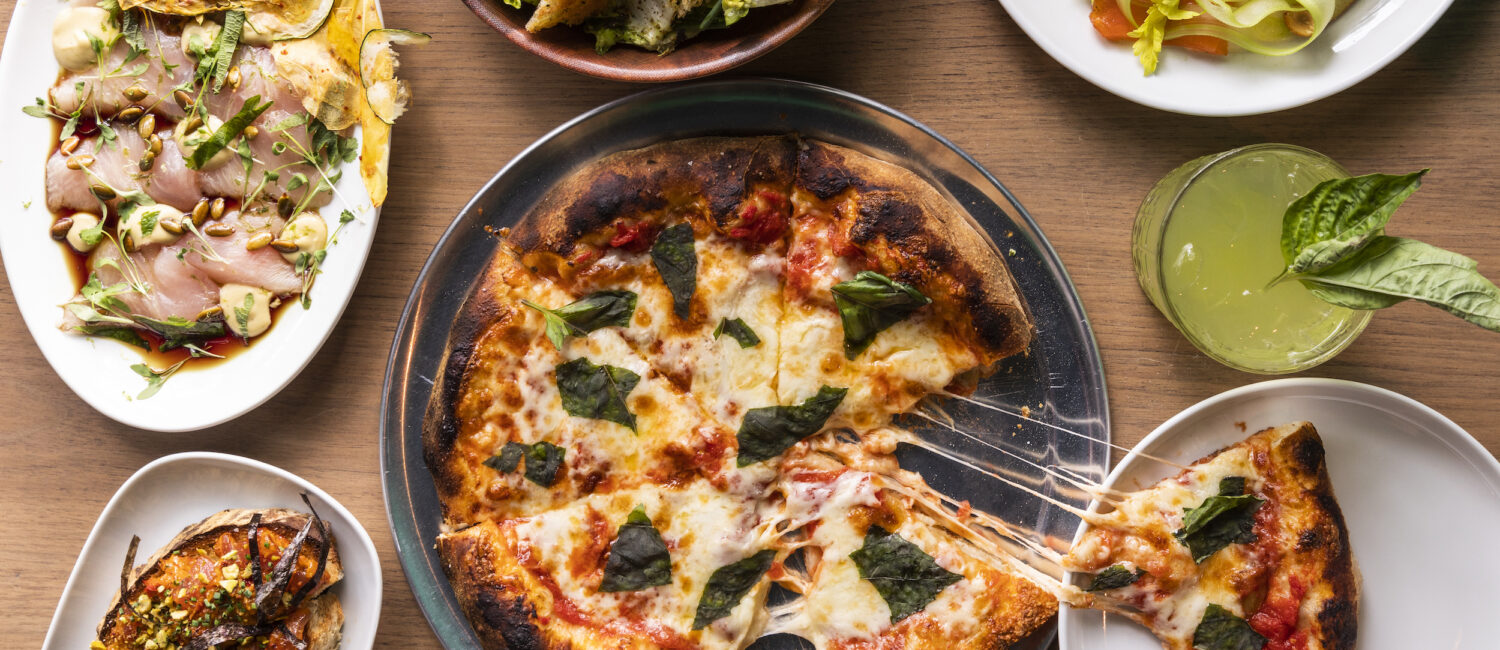 An array of food at Elro Pizza + Credo (Photo by Julie Soefer)