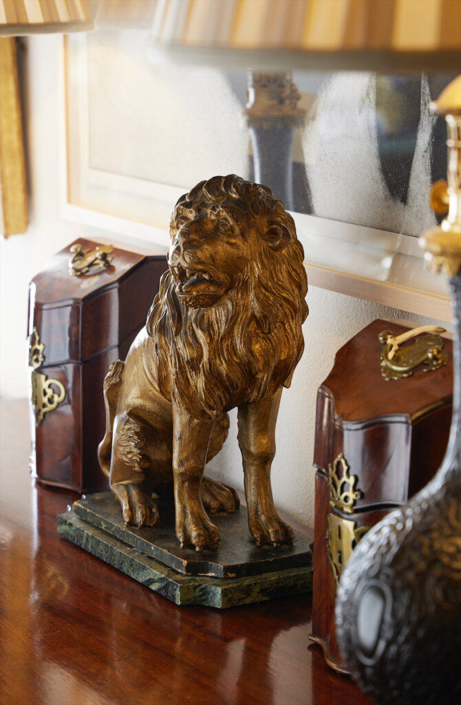Carved and gilded 18th-century lion, France;
pair of George III petite knife boxes. (Photo by Kris Ellis)
