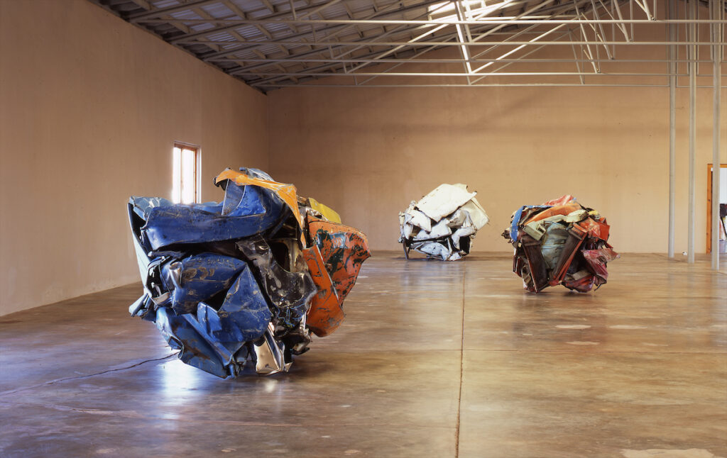 John Chamberlain’s "22 variously titled works in painted and chromium-plated steel," 1972-1982, at The Chinati Foundation (photo by Florian Holzerr, courtesy of the Chinati Foundation)