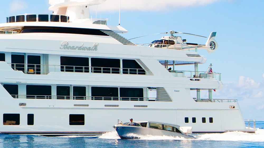 Tilman Fertitta's 252-foot superyacht  'Boardwalk' with the H130 helicopter perched on top (Photo courtesy of Fertitta Entertainment)
