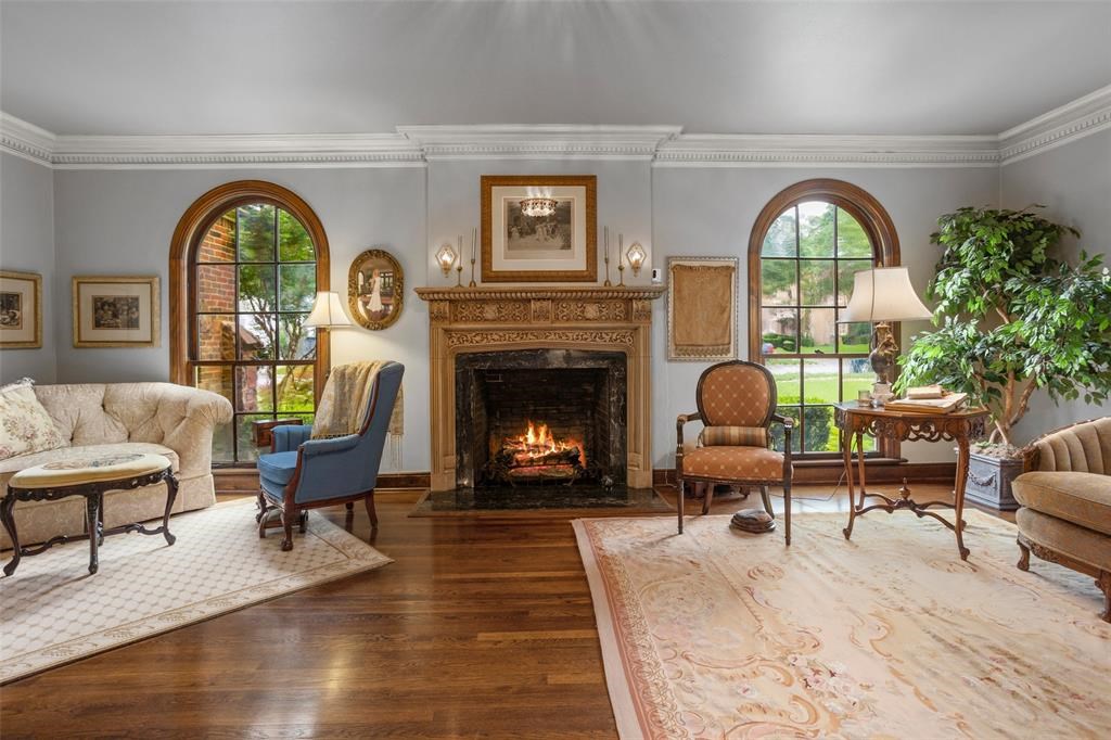 One of the stately Fort Worth home's fireplaces at 2423 Medford Court add a warm touch to the formal living area..