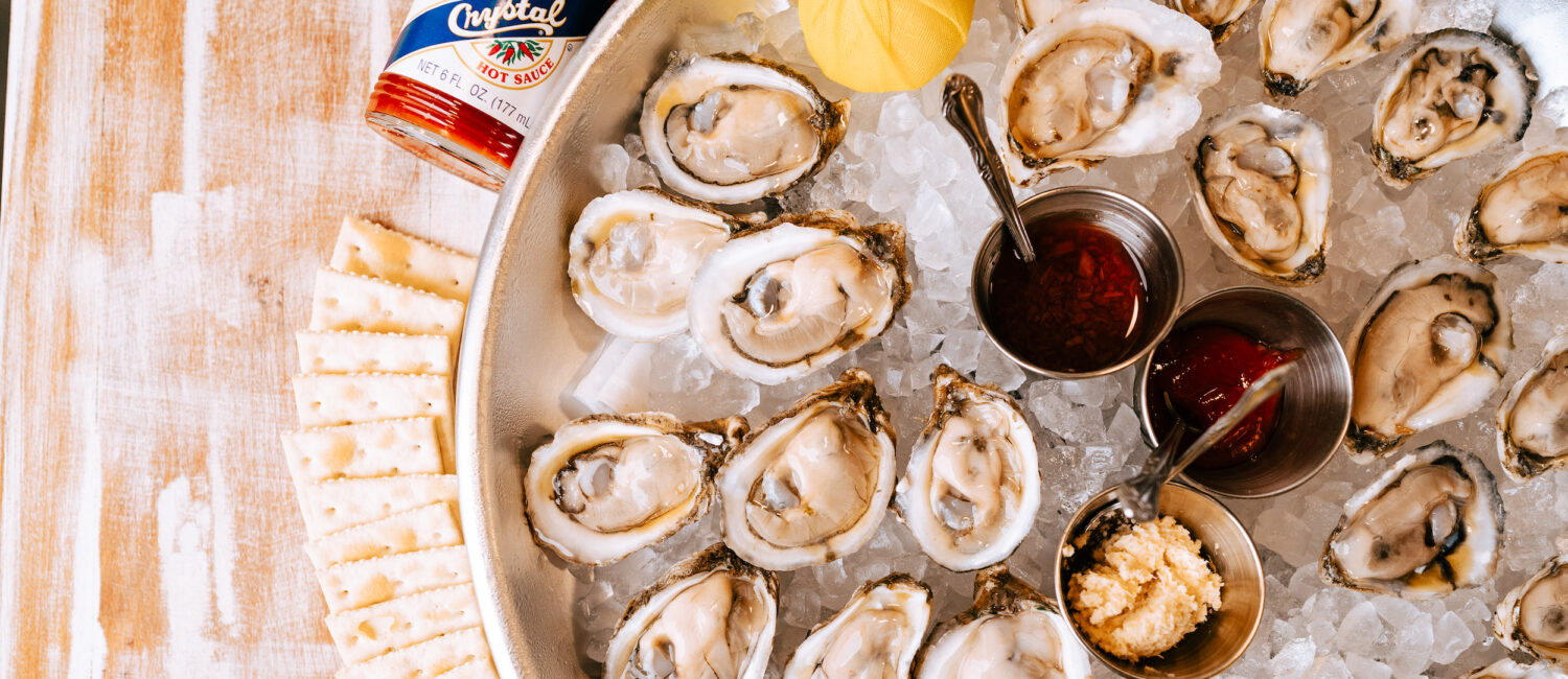Raw oysters, cocktail sauce, mignonette, horseradish, hot sauce and crackers are served at the oyster bar inside the new Josephine's restaurant in Midtown. (Photo by Ally Hardgrave )