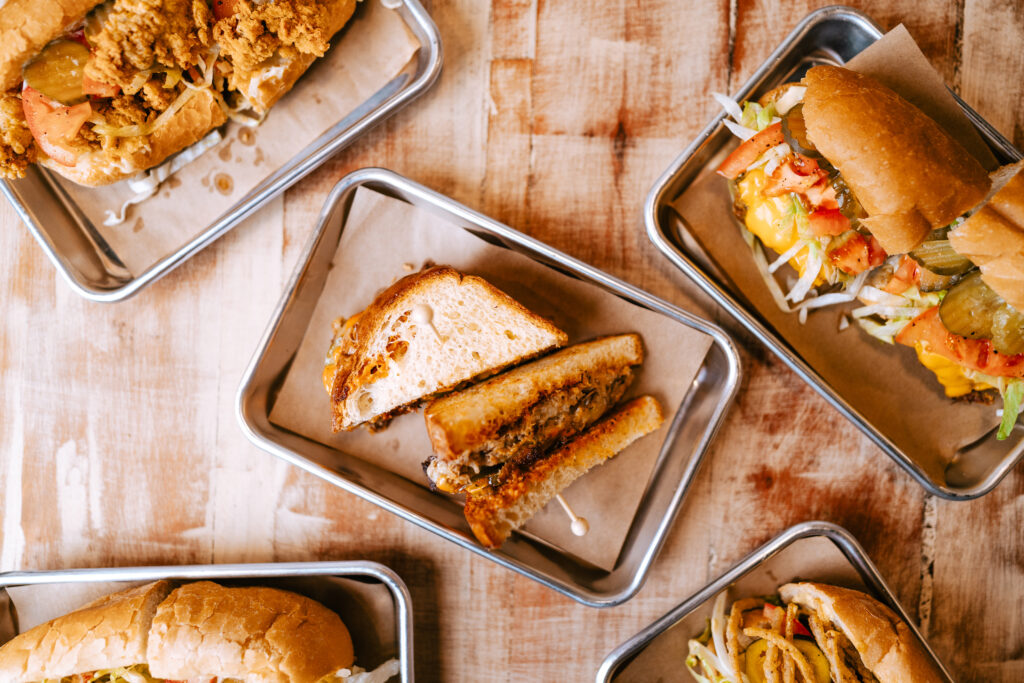 From top left: Po-boy Center: Smashed boudin melt Right: Biloxi Vancleave Special Bottom: Sittin' Sideways Cheeseburger served at the new Josephine's. (Photo by  Ally Hardgrave )