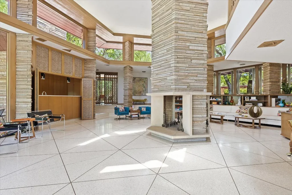 The focal point fireplace soars to to the second story.