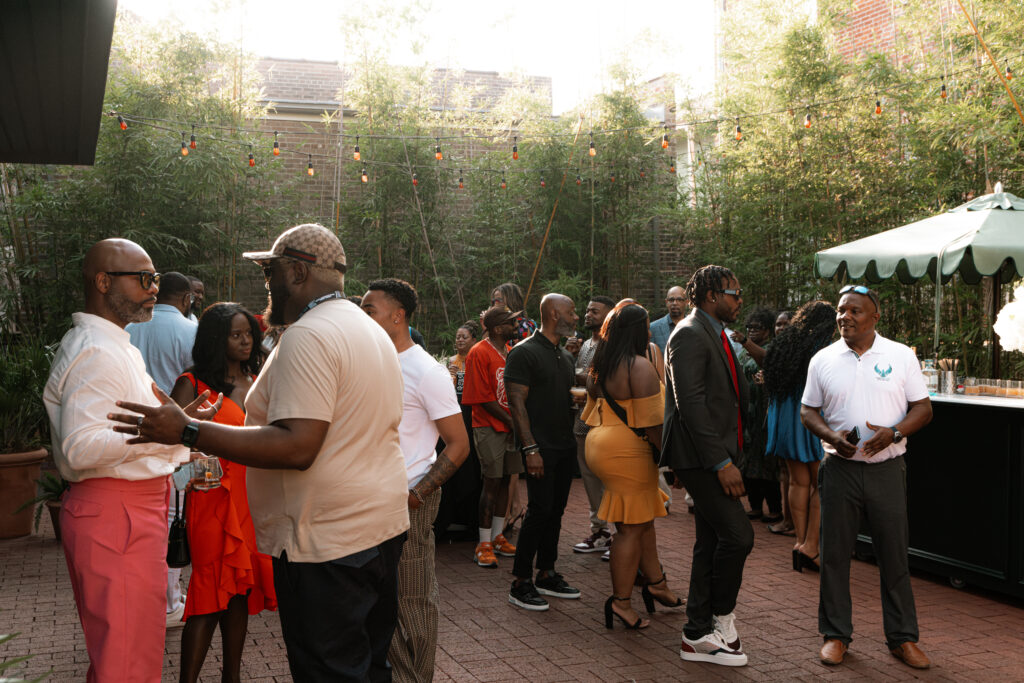The lively crowd at the Knight's Table cocktail reception (Photo by William Issac)