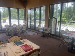 The Rise patio has windows that look out into a forested area, and can be fully opened when weather allows.