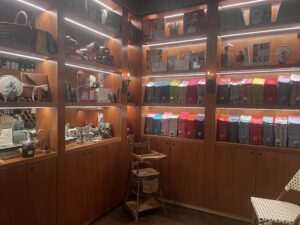 The reception area at Rise has many French antique pieces, and a full line of torchons with special messages for purchase.