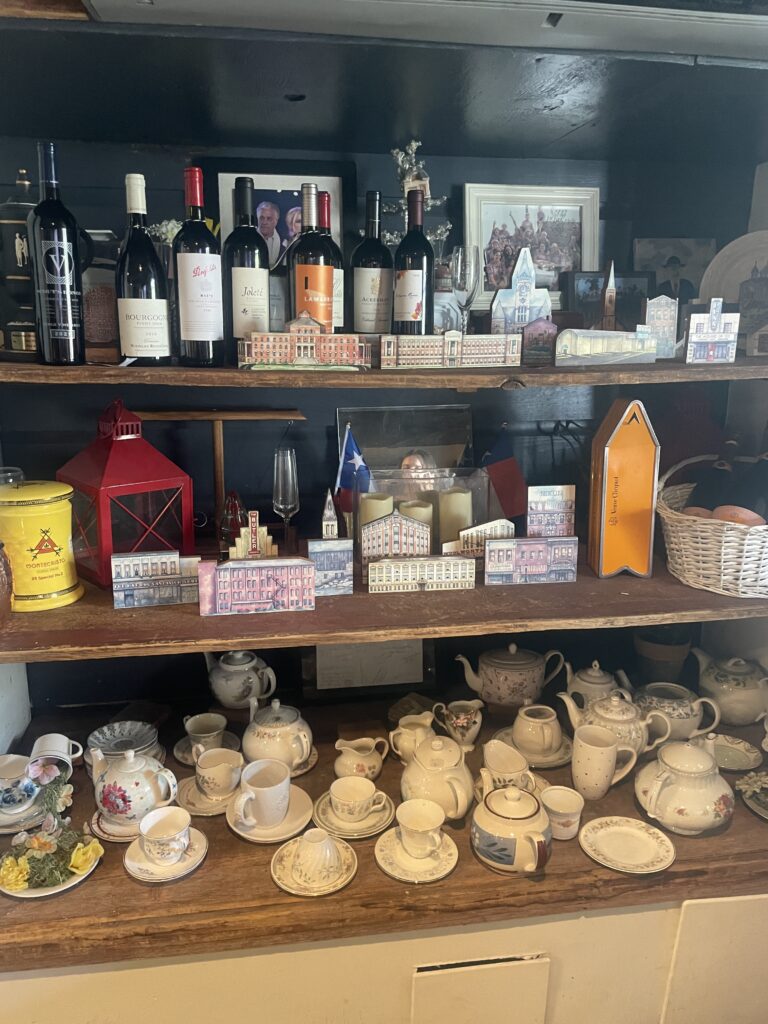 The Butler House's pantry houses important mementos — from small reproductions of buildings from Butler, Pennsylvania to a wedding photo of Bryan and Mariana, who got married at the property.