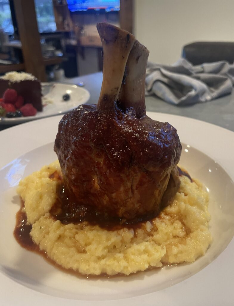The pork osso bucco at The Butler House is a hearty portion with fork tender pork and creamy polenta.