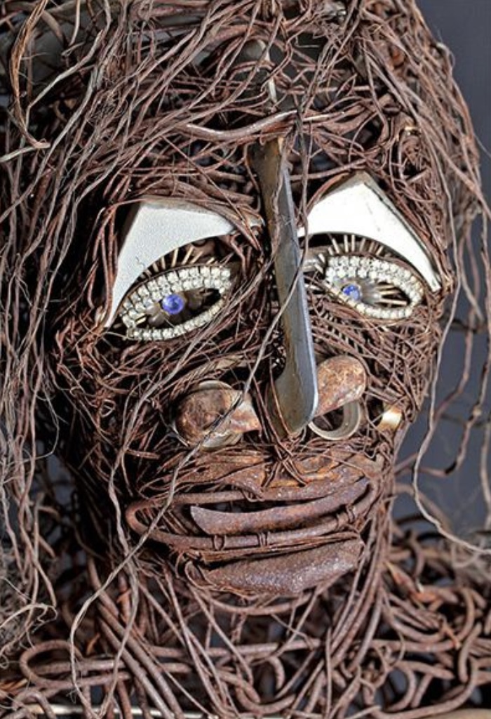 Jesse Lott's "Big Girl (A Tribute To Eula Love)," 1980, a dramatic sculpture fashioned from copper, aluminum, steel, and wire with found objects. (Courtesy Deborah Colton Gallery, Houston)