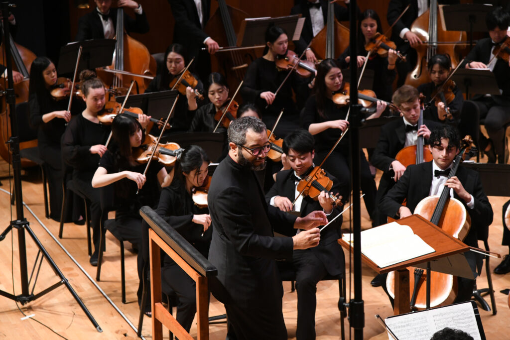 Maestro Andrew Grams with the TMF Orchestra at the final concert of the Texas Music Festival (Photo by Jeff Grass)