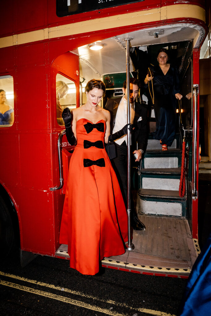  Skylar Pinchal and Oliver Coysh wedding guests departing double-decker buses for the after-party.