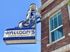 Walloon’s – Signage installed on the historic 1927 building’s facade. (Photo by Courtney Dabney)