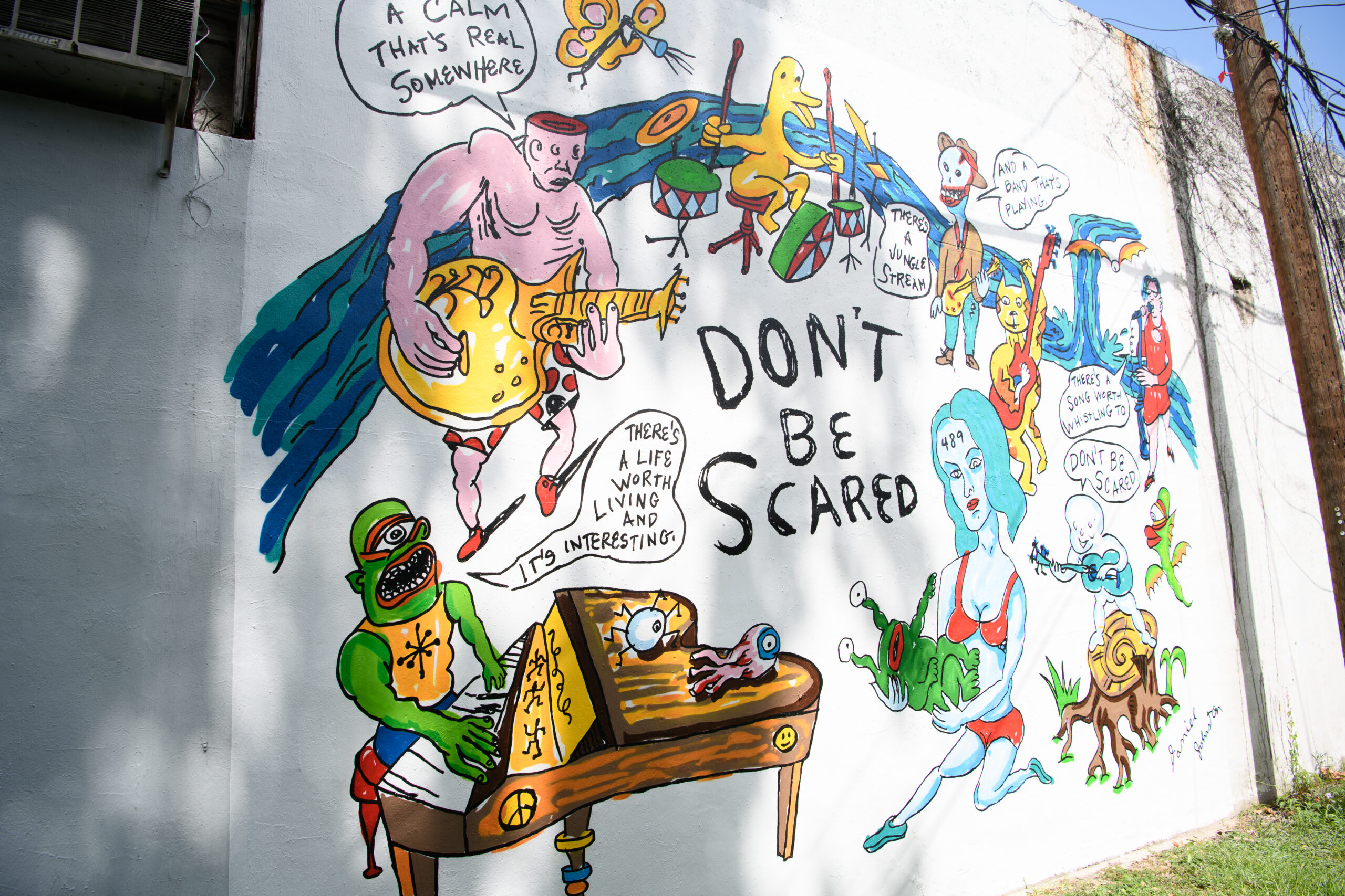 The "Don't Be Scared" mural at Redbud Arts Center honors the legacy of the late Daniel Johnston.