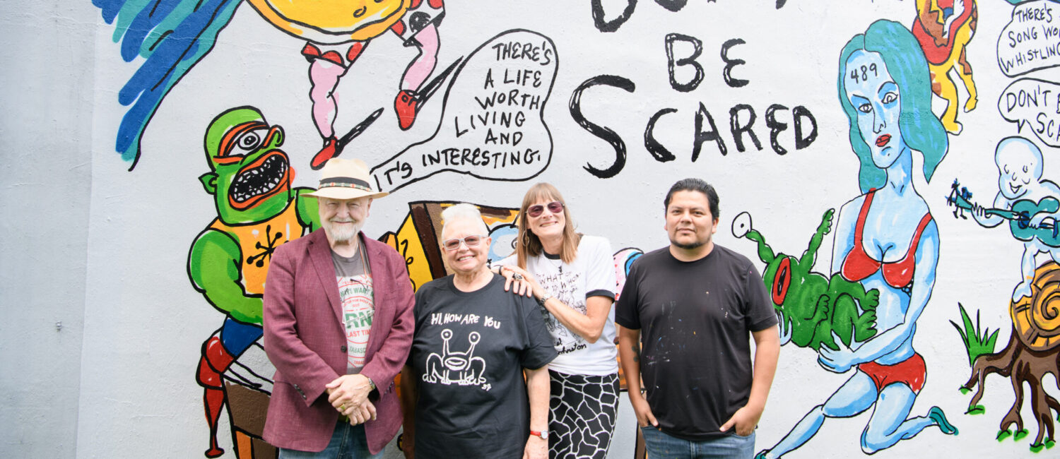Redbud Arts Center president Gus Kopriva, executive director Tanya Peterson, Marjory Johnston, Carlos Alcaraz (Empyre) get together at the "Don't Be Scared" mural honoring the late artist Daniel Johnston. (Photo by Saranna Zhang/Kevin Zhang Photography)