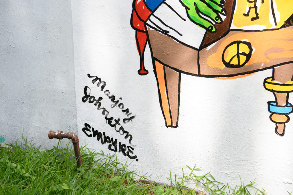 Marjory Johnston and Carlos Alcaraz (Empyre) signatures on the "Don't Be Scared" mural (Photo by Saranna Zhang/Kevin Zhang Photography)